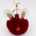 Close-up of wine red faux fur rabbit head keychain with glitter ears and golden metal clasp - Bunny Ear Pom Pom Keychain / Burgundy