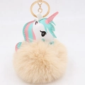 Unicorn faux fur pompom keychain with pastel leather head and golden metal clasp - Nude
