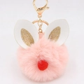 Close-up of pink fur ball keychain with white rabbit ears and golden metal ring - Bunny Ear Pom Pom Keychain / Pink