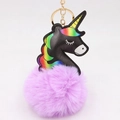 Detail of black leather unicorn keychain with purple fluffy pom pom and golden ring - Taro Purple