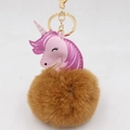 Detail of unicorn plush keychain with pink PU leather patch and fluffy brown pom pom ball - Gold Keychain / Coffee