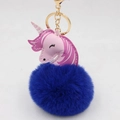 Close-up of deep blue fur pompom unicorn keychain with gold metal clasp and leather head - Gold Keychain / Sapphire Blue