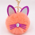 Detail of plush orange cat keychain with purple sequin ears and teardrop gem nose - Orange Red