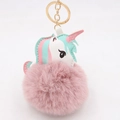Detail of cute unicorn plush ball keychain with pink faux fur and gold metal clasp - Dust Rose