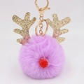 Detail of Christmas reindeer plush keychain with purple faux fur and golden antlers - Christmas Deer Style (圣诞鹿钥匙扣) / Taro Purple