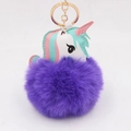 Detailed view of purple unicorn pompom keychain with soft faux fur and gold metal clasp - Purple