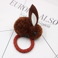 Detailed macro view of a brown plush bunny hair tie with soft faux fur and elastic band - Coffee Hair Tie