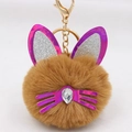 Close-up of brown plush cat keychain with sequin ears and teardrop crystal nose - Coffee