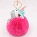 Detail of a rose pink fluffy unicorn keychain with plush ball and gold metal ring - Rose Red