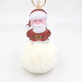 Dettaglio del ciondolo di Babbo Natale in pelle e pompon bianco in ecopelliccia morbida - Portachiavi d'Oro / Bianco avorio