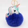 Detailed view of white leather unicorn charm with a large navy blue fluffy pom pom keychain - Sapphire Blue