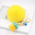 Cute yellow plush pineapple pom pom keychain with a blue bell and gold hardware hook - Yellow