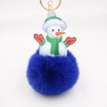 Detail of a plush Christmas snowman keychain with a soft dark blue faux fur pom pom - Sapphire Blue