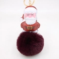 Dettaglio del ciondolo di Babbo Natale in pelle PU con pompon in finta pelliccia bordeaux - Portachiavi d'Oro / viola-rosso