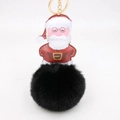 Dettaglio ciondolo Babbo Natale in pelle PU e grande pompon nero in pelliccia sintetica - Portachiavi d'Oro / Nero