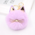 Detail of purple faux fur cat keychain with golden heart whiskers and sequined ears - Taro Purple