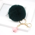 Close-up of deep green faux fur pompom keychain with gold lobster clasp and pink bell - Dark Green