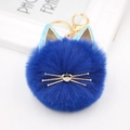 Detail of royal blue fluffy cat plush keychain with gold whiskers and lobster clasp - Sapphire Blue