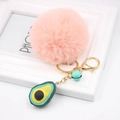 Detail view of pink pom pom keychain with avocado charm and golden lobster clasp - Avocado Keychain / Pink
