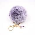 Detail of purple faux fur pompom keychain with golden metal ring and unicorn charm - Small Unicorn Keychain / Two-tone Purple