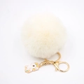 Detailansicht Einhorn-Schlüsselanhänger mit cremefarbenem Kunstfell-Bommel und Goldclip - Einhorn Schlüsselanhänger / Cremeweiß