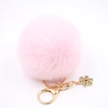 Porte-clés pompon en fausse fourrure rose avec anneau doré et pendentif flocon - Rose Clair