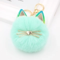 Mint green plush cat ball keychain with golden metal ears and lobster clasp on white background - Colored Ear Cat / Mint Green