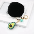 Detail of avocado keychain featuring a black faux fur pom pom and gold-tone lobster clasp - Avocado Keychain / Black