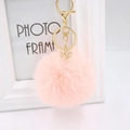 Detail of pink plush keychain with gold alloy snowflake charm and lobster clasp - Pink
