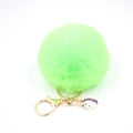 Detail of neon green faux fur pompom keychain with golden unicorn pendant and clip - Small Unicorn Keychain / Fluorescent Green