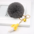 Detail of grey fluffy pompom keychain with golden clip and creative resin banana pendant - Dark Gray