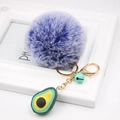 Plush blue fur ball keychain with green avocado pendant and small bell accessory - Avocado Keychain / Double Blue