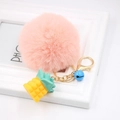 Pink fluffy pom pom keychain with gold resin pineapple pendant and blue bell detail - Pink