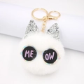 White plush cat keychain with silver sequin ears and ME OW glasses on white background - White