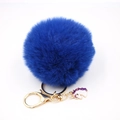 Close-up of fluffy dark blue pompom keychain with golden lobster clasp and unicorn charm - Small Unicorn Keychain / Sapphire Blue
