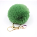 Detail of dark green faux fur pompom keychain with golden metal ring and unicorn charm - Small Unicorn Keychain / Army Green