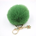 Détail du porte-clés pompon en fausse fourrure verte avec flocon de neige doré et fermoir - Vert Militaire
