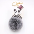 Halloween lederen schedel en grijze pluche pompon sleutelhanger met gouden haak - Tweekleurig Zwart