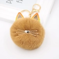 Süßer brauner Plüsch-Katzenkopf-Pompon-Schlüsselanhänger mit goldenen Schnurrhaaren - Katze mit farbigen Ohren / Kaffeebraun