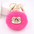 Hot pink fluffy bull head keychain with golden horns and matching metal keyring - Gold Keychain / Rose Red