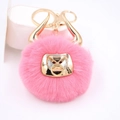 Detail of pink plush bull keychain with golden horns and nose ring ornament - Gold Keychain / Deep Pink