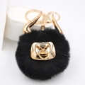 Detail of black faux fur bull keychain with gold horns and metallic hardware for bags - Gold Keychain / Black