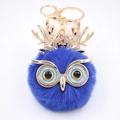 Détail du porte-clés chouette en peluche bleu roi avec bois dorés et yeux pailletés - Porte-clés Doré / Bleu Saphir