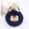Detail of navy blue faux fur bull keychain with golden horns and metallic nose ring - Gold Keychain / Navy Blue
