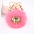 Detailed view of pink faux fur bull keychain with golden metal horns and ring - Gold Keychain / Watermelon red