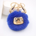 Detailed view of royal blue bull plush keychain with gold horns and lobster clasp - Gold Keychain / Sapphire Blue