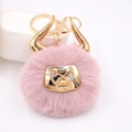Pink plush bull head keychain with golden horns and D-ring, featuring soft faux fur texture - Gold Keychain / Dust Rose