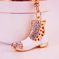 Fashionable sparkling crystal rhinestones and white enamel boot keychain with gold-plated finish - White