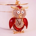 Sparkling cute owl keychain with red enamel wings and crystal rhinestones on gold metal - Red