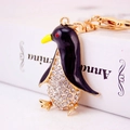 Creative gold-plated penguin keychain with sparkling rhinestones and black enamel finish - Colorful
